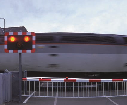 Level crossing: Train going through level crossing
