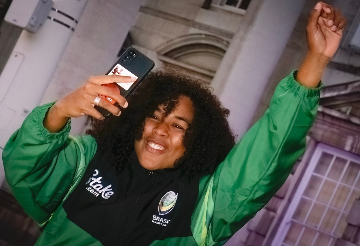 Reception 1: A member of the Brazil party enjoys the atmosphere outside Leeds Civic Hall.