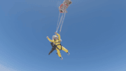 A final wave as his chute opens: A final wave as his chute opens