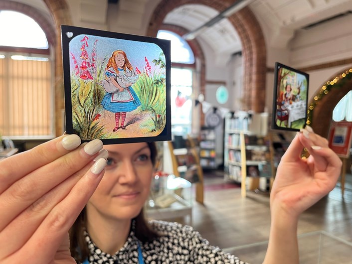 Magic lantern slides: Rhian Isaac, special collections librarian at Leeds Central Library, with the vintage magic lantern slides featuring moments from classic tales including Alice in Wonderland, Peter Pan and Aladdin.