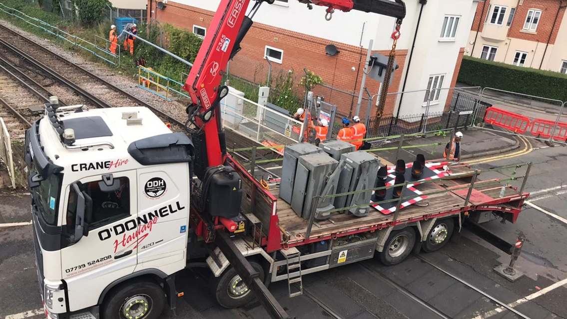 Passengers reminded to check before travelling as buses replace trains while Network Rail continues £116m reliability-boosting resignalling scheme in south west London and Berkshire: Egham level crossing