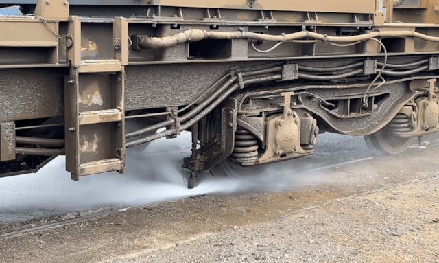 Treatment train water blasting railhead close up - Network Rail: Treatment train water blasting railhead close up - Network Rail