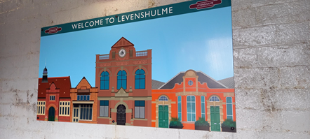 This image shows art at Levenshulme depicting the Antique Village