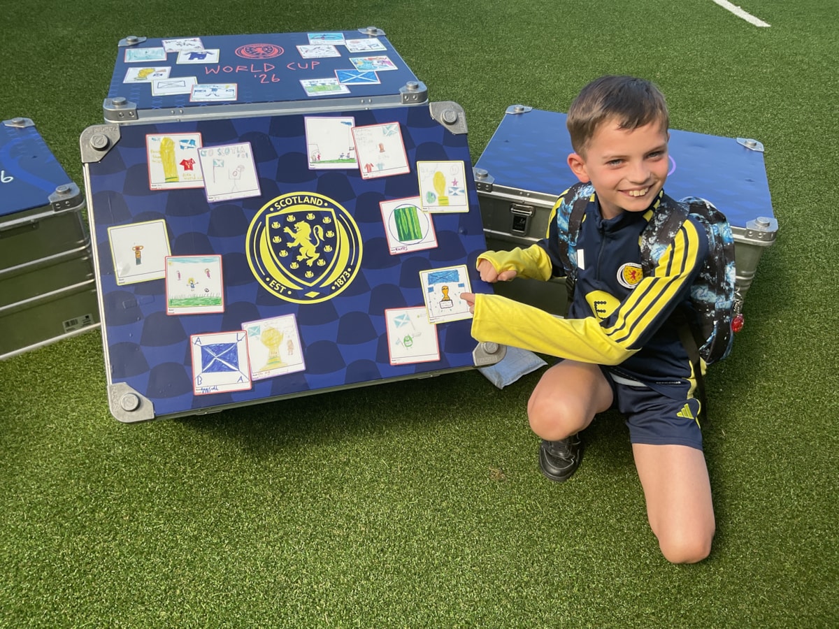 Aidan with his artwork