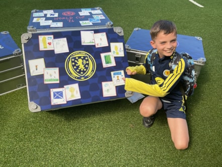 Aidan with his artwork