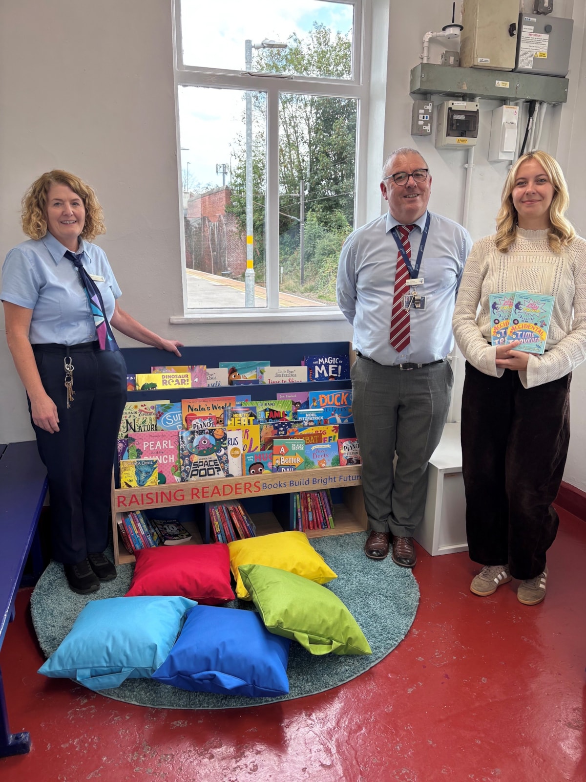 Author Amelia Tait with Mike Drewery and Thirsk station team