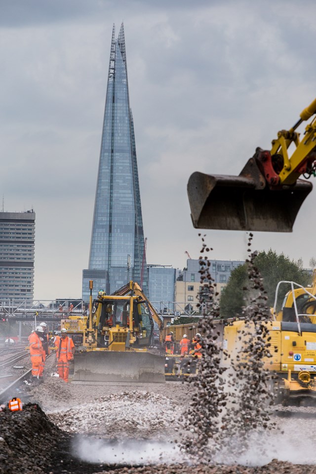 London Bridge August 2015: Crushed stones - ballast - are dropped at London Bridge to form the base for new track as part of the Thameslink Programme
