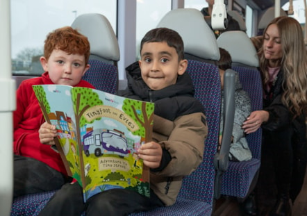 Children x2 with book