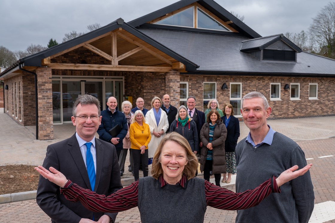 Jeremy Wright MP, Burton Green Village Hall Chair Cheryl Wall , and HS2 Senior Project Manager Alan Payne, pictured with trust members in front of the new facility