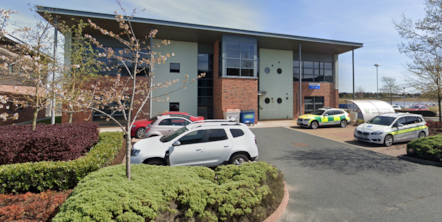 Winter house in background and the car park with ambulance cars in the foreground.