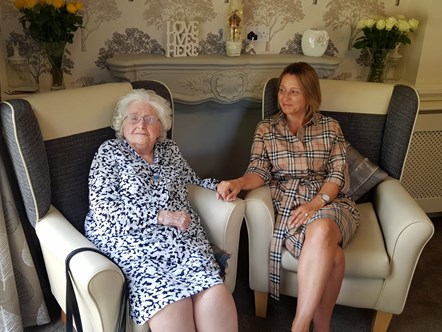 Resident Betty with care home manager Nischa