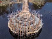 Hundreds of larch trees ranging in size from between 10m and 2m were felled by hand to meet the specific requirements of the crannog reconstruction. Image Andrew Allan: Hundreds of larch trees ranging in size from between 10m and 2m were felled by hand to meet the specific requirements of the crannog reconstruction. Image Andrew Allan