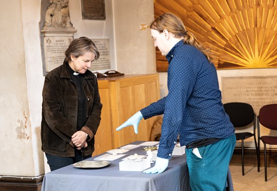 Stories of St James's Gardens Exhibition, St James's Church, Piccadilly-3: Finds Specialist, Owen Humphries, MOLA, talking to The Rev. Lucy Winkett, Rector of St James’s Church Piccadilly, inspecting grave goods uncovered during the excavation of St James's Burial Ground, Euston. 

Visitors will be able to see the items at two special events at the Church on 11th & 16th Ap