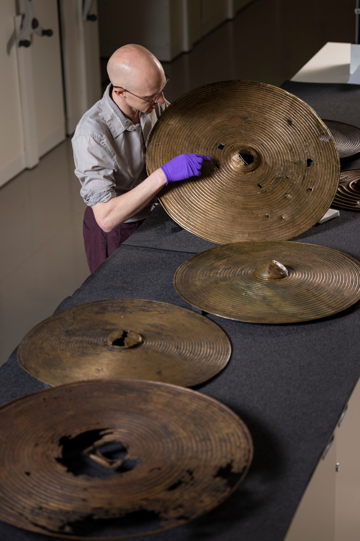 National Museums Scotland curator Dr Matthew Knight with the Bronze Age shields. Photo © Duncan McGlynn (8)