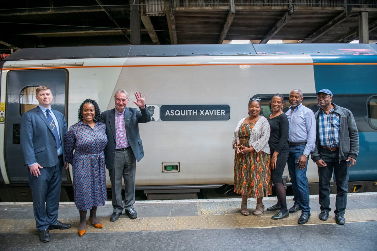 Senior Assistant General Secretary of RMT Union, Eddie Dempsey and former work colleague of Asquith's Tony Donaghy (left) with Asquith's family