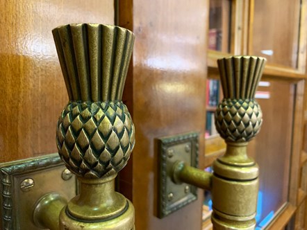 Detail of thistle-shaped door handles at the entrance of the Library's General Reading Room at George IV Bridge, Edinburgh.