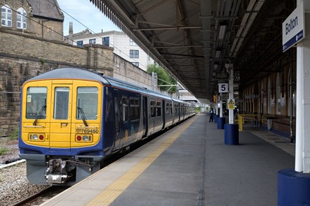 A Northern train stands at Bolton station