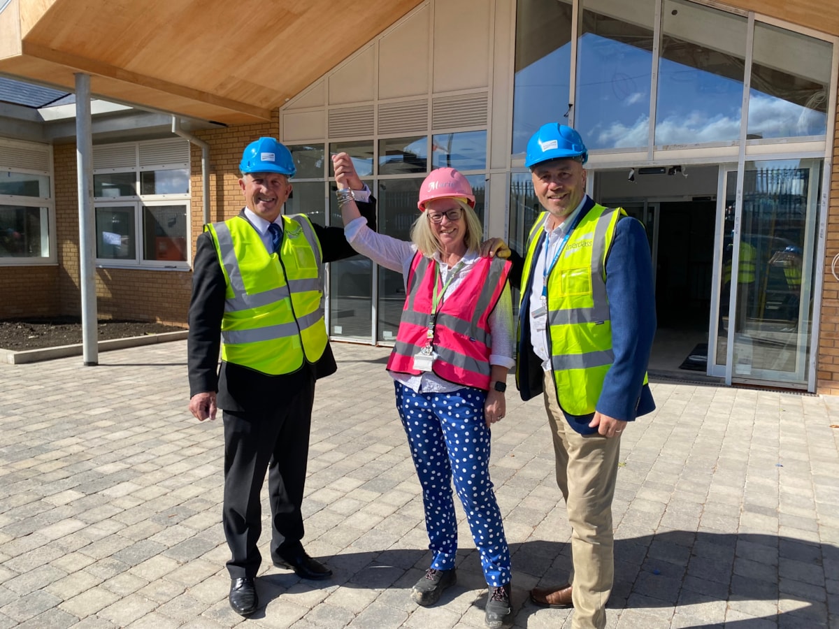 Cllr Steve Clark, headteacher Marie Hunter and Cllr Wayne Little at the entry to the new school site