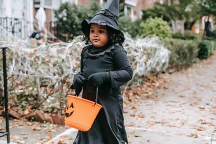 little girl in witch costume credit charles parker pexels