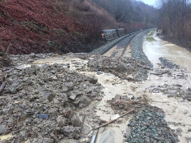 The line was closed on Sunday 21 January after heavy rain caused a landslip at Dinas Rhondda, blocking the railway line