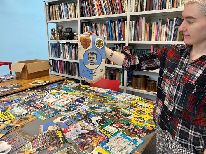 LUFC programme donation: Amy Thraves-Connor has been working on a placement with Leeds Museums and Galleries, scouring through boxes of the donated programmes, searching for those which help tell both the story of the club and how the team has influenced life in Leeds both on and off the pitch.