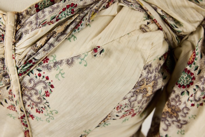 Feeding dress 3: One item on display is a dress worn for feeding nearly 200 years ago. Although it might look like a typically restrictive dress from the 1830’s, a closer look reveals it has been adapted for a mother to breastfeed her baby through a cleverly concealed opening.